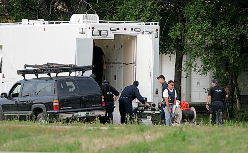 BORIS MINKEVICH / WINNIPEG FREE PRESS  070819 Possible armed standoff scene on McGregor Farm Road just north of Bricker Ave. in East St. Paul. RCMP used their SWAT team and robot in the operation. Robot is being unloaded from the big white truck.