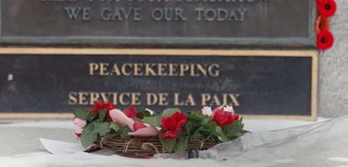 For File . Centotaph plaque to Peace Keepers with flower tribute a day after Remembrance Day . In Memorial Park   . NOV. 12 2014 / KEN GIGLIOTTI / WINNIPEG FREE PRESS