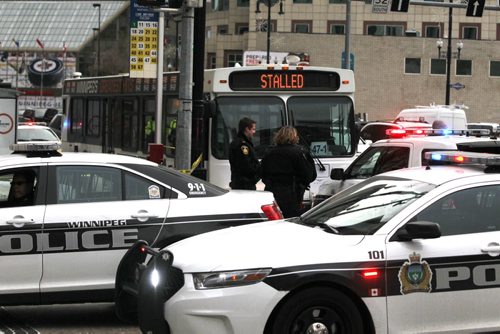 Police scene on Main Street and McDermot Ave. Bus was taped off. Causing traffic havoc. BORIS MINKEVICH / WINNIPEG FREE PRESS November 12, 2014