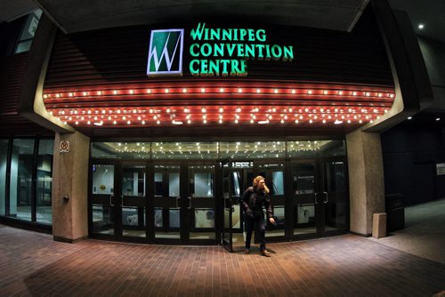 A pedestrian leaves the Convention Centre at the end of the day Wednesday.  141112 November 12, 2014 Mike Deal / Winnipeg Free Press