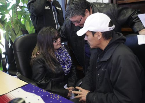 Julie and Caesar Harper, mother and father of  Rinelle Harper share a moment with Andrew Colombe, Chief of Marcell Colombe First Nation after press conference Thursday at MKO.  Nov 13,  2014 Ruth Bonneville / Winnipeg Free Press