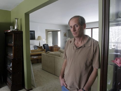 Marc Pullan in his home on Buckingham Road. He is upset after he is unable to get an appointment with the City of Winnipegs assessment department to consider his homes re-assessment. The city sent out 100,000 notices two weeks ago but only made provision for 1,065 appointments, which will all take place during a five-day blitz next week. Aldo Santin story WAYNE GLOWACKI / WINNIPEG FREE PRESS  Nov.13 2014
