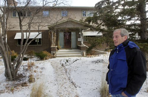 Marc Pullan in front of his home on Buckingham Road. He is upset after he is unable to get an appointment with the City of Winnipegs assessment department to consider his homes re-assessment. The city sent out 100,000 notices two weeks ago but only made provision for 1,065 appointments, which will all take place during a five-day blitz next week. Aldo Santin story WAYNE GLOWACKI / WINNIPEG FREE PRESS  Nov.13 2014