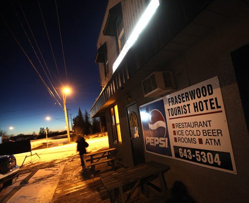 The Fraserwood Tourist Hotel and Beverage Room glows along the village main street in the Interlake north of Winnipeg. November 13, 2014 - (Phil Hossack / Winnipeg Free Press)