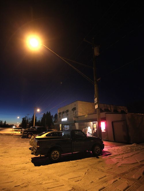The Fraserwood Tourist Hotel and Beverage Room glows along the village main street in the Interlake north of Winnipeg. November 13, 2014 - (Phil Hossack / Winnipeg Free Press)