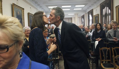 Conservative Leader Brian Pallister stops to kiss his wife Esther as he arrives to deliver his alternative throne speech to a crowd of Tory supporters at the Manitoba Legislative Bld. Friday morning. Larry Kusch / Bruce   Owen stories Wayne Glowacki / Winnipeg Free Press Nov. 14 2014