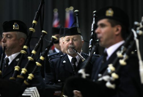 Police Piper Stuart McPherson helps pipe in Nineteen members of class #156 who received their honors and certificates in a ceremony at the Convention Center. See release. November 14, 2014 - (Phil Hossack / Winnipeg Free Press)