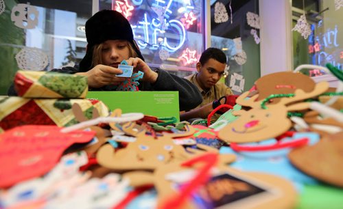 At Art City on Broadway, Anya Repko, 13, and Korrdel Christian, 15, working on Christmas decorations and gifts that will be handed out during the Santa Claus Parade on Saturday, Friday, November 14, 2014. (TREVOR HAGAN/WINNIPEG FREE PRESS)