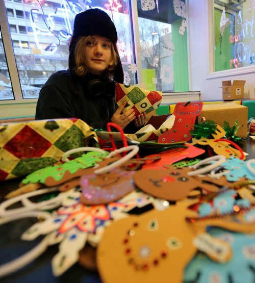 At Art City on Broadway, Anya Repko, 13, working on Christmas decorations and gifts that will be handed out during the Santa Claus Parade on Saturday, Friday, November 14, 2014. (TREVOR HAGAN/WINNIPEG FREE PRESS)
