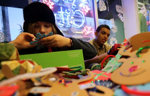 At Art City on Broadway, Anya Repko, 13, and Korrdel Christian, 15, working on Christmas decorations and gifts that will be handed out during the Santa Claus Parade on Saturday, Friday, November 14, 2014. (TREVOR HAGAN/WINNIPEG FREE PRESS)