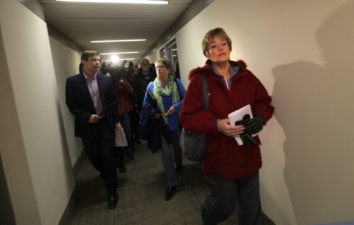 Darlene Dziewit (front) and Becky Barrett both senior NDP members dodge questions from media as they make their way out of the NDP head office after executive meeting Saturday.    Nov 15,  2014 Ruth Bonneville / Winnipeg Free Press