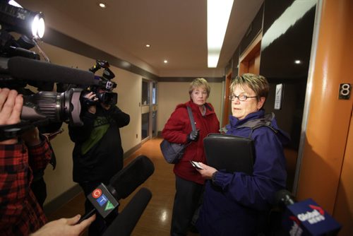 Becky Barrett (front) and Darlene Dziewit both senior NDP members dodge questions as they make their way out of the NDP head office after executive meeting Saturday.    Nov 15,  2014 Ruth Bonneville / Winnipeg Free Press
