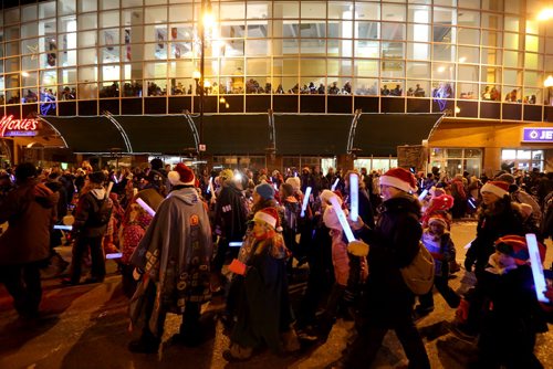 People stay warm and watch the Santa Claus Parade from inside MTS Centre, Saturday, November 15, 2014. (TREVOR HAGAN/WINNIPEG FREE PRESS)