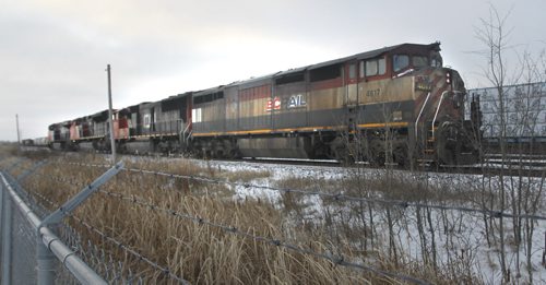 A BC Rail locomotive and three CN locomotives on the rail line along the TransCanada Hwy. east of the CNR Symington Yards after a minor collision Monday morning. Wayne Glowacki/Winnipeg Free Press Nov. 17 2014