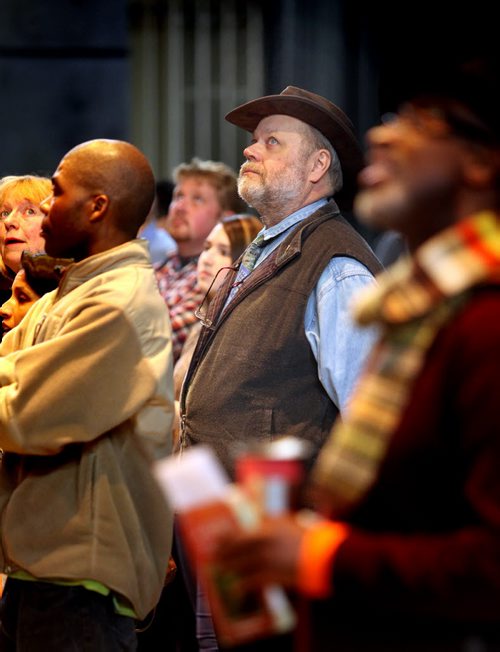 Matthias Laucht, who fled East Germany in 1953 and came to Canada with this parents at the age of four stands onstage looking up at the "house" as he and some three dozen refugees from around the world rehearse for the upcoming opera production of Fidelio. A second refugee Quesney Ramazani Buledi was unable to be at the Concert Hall for the rehearsal due to changed working hours. See Carol Sanders story. November 17, 2014 - (Phil Hossack / Winnipeg Free Press)