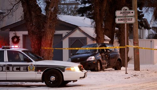 The Henderson Hwy. south bound lanes were closed after an early Wednesday morning crash. Police diverted traffic around the crash site. The damaged vehicle was along side the yard of a home on Roosevelt Place at Henderson Hwy. Wayne Glowacki / Winnipeg Free Press Nov. 19  2014