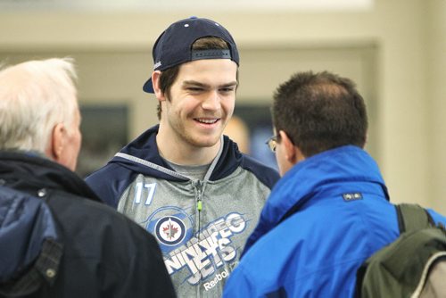 Winnipeg Jets' Adam Lowry (17) talks to fans before practice Wednesday morning.  141119 November 19, 2014 Mike Deal / Winnipeg Free Press