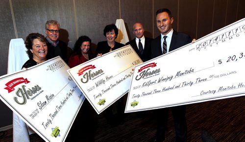 Big cheques from Our Manitoba Heroes committee were handed out Wednesday to three deserving organizations. Gathered for the photo from left, Judy Richichi representing the Siloam Mission, Paul Bennett, Committee Chair and Brenda Bourns both with Our Manitoba Heroes, Judy Robertson, representing the Wildlife Haven Rehabilitation Organization, Jeff McWhinney,  Our Manitoba Heroes committee member and Matt Erhard representing KidSport Winnipeg. The three local charities each received $20,333.00 from the proceeds from the Our Manitoba Heroes gala event that was held September 27th.  Wayne Glowacki / Winnipeg Free Press Nov. 19  2014