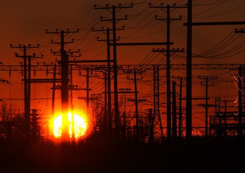 Chilly morning- The sun rises behind power lines near the CP rail line as Winnipeg woke up to a chilly -22C morning Thursday morning- Standup Photo Nov 20, 2014   (JOE BRYKSA / WINNIPEG FREE PRESS)
