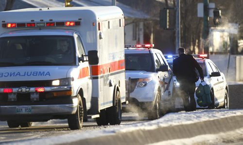Emergency vehicles on Nairn Ave. near Keenleyside St. Thursday morning after a report of a child struck by a vehicle. Wayne Glowacki / Winnipeg Free Press Nov. 20  2014