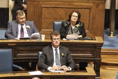 Two of the members of the NDP rebel gang of five sit in there new seats in the Manitoba Legislative Assembly Chamber for the throne speech; Jennifer Howard (Fort Rouge), and Andrew Swan (Minto) with NDP backbencher Jim Malloway (Elmwood).  141120 November 20, 2014 Mike Deal / Winnipeg Free Press