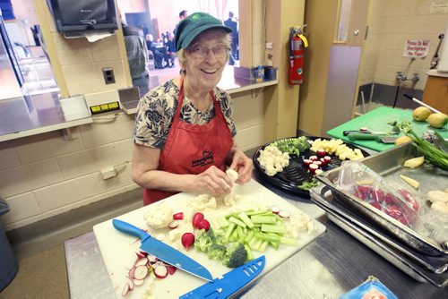 Eleanor Moore smiles in the kitchen at 2nd annual Agape Tables open house- 175 Colony  The agency requires volunteers for the upcoming holiday busy season and held a open house today. Those interested can contact Agape Table at www.agapetable.ca- Standup Photo Nov 20, 2014   (JOE BRYKSA / WINNIPEG FREE PRESS)
