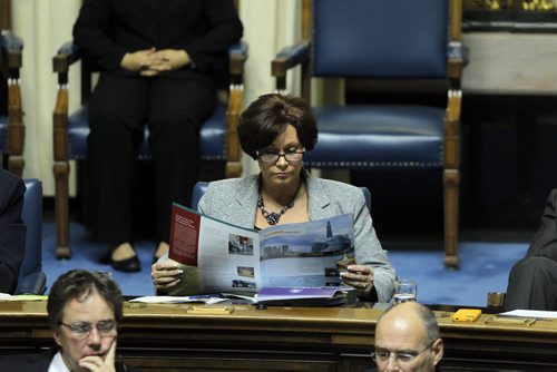 Question Period at the Manitoba Legislature. Ex minister Theresa Oswald kills some time by opening her mail during QP. BORIS MINKEVICH / WINNIPEG FREE PRESS November 21, 2014