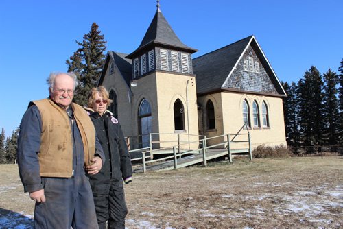 CAPTION - Cameron Dodds and Bea Janssens take one last look around the Shiloh United Church near Kenton, built in 1903, which is scheduled to be demolished. BILL REDEKOP/WINNIPEG FREE PRESS Nov 21,2014