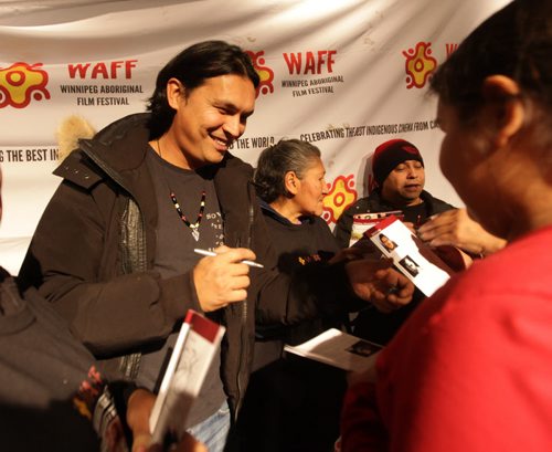 Actor Adam Beach signs autographs Saturday night  at the Ellice Theatre during the  20th anniversary of the release of his film "Dance Me Outside"  during the Winnipeg Aboriginal Film Festival.   Standup photo. Nov 22,  2014 Ruth Bonneville / Winnipeg Free Press