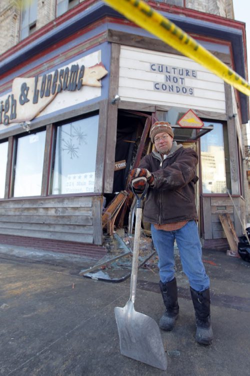 LOCAL - SUV crashes into doors in Winnipeg nightclub Times Change(d). The crash happened at around 9:15 a.m. at the corner of Main Street and St. Mary Avenue. John Scoles is the owner and is scene in front of his business. BORIS MINKEVICH / WINNIPEG FREE PRESS November 24, 2014