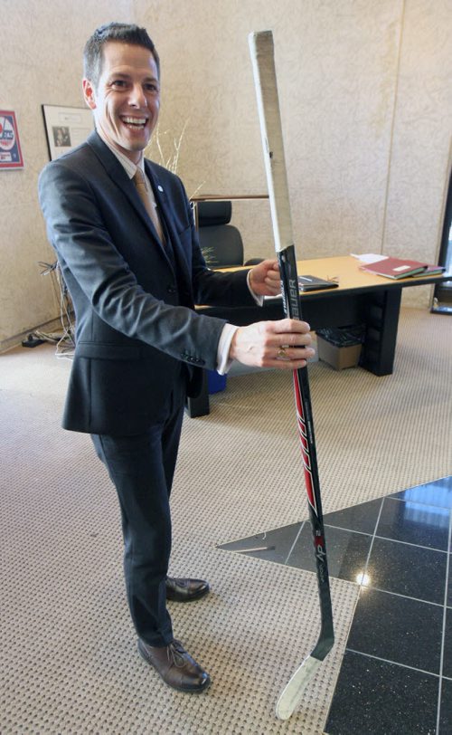 Winnipeg mayor Brian Bowman in his office speaks of his positive national media coverage of late.- he holds a Mark Scheifele Winnipeg Jets stick- See Gordon Sinclair story Nov 24, 2014   (JOE BRYKSA / WINNIPEG FREE PRESS)