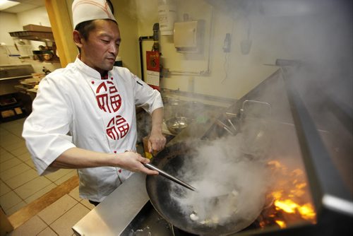 November 24, 2014 - 141124  -  Owner and chef Hongbin Yu of Fu Lin cooks up the lamb for a Hot Pot November 24, 2014. John Woods / Winnipeg Free Press
