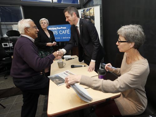 Wpg Mayor Brian Bowman shakes hands with retired DR.Roodal Ramchandar  before meeting the Winnipeg Free Press Editorial Board at the News Cafe .WFP ED Board members Shannon Sampert , Dave O'Brien Catherine Mitchell .NOV. 25 2014 / KEN GIGLIOTTI / WINNIPEG FREE PRESS