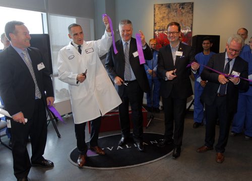 BIZ - Official inauguration of Valeant Canadas newly improved facility in Steinbach, Manitoba marking the completed transfer of the companys natural health products manufacturing business unit. MLA Kevin Chief leads the crew in a celebratory ribbon cutting photo. He is wearing a lab jacket. BORIS MINKEVICH / WINNIPEG FREE PRESS November 25, 2014
