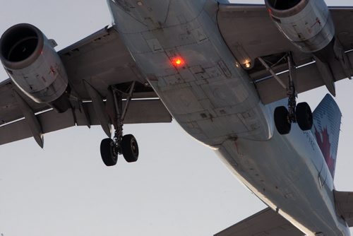 A Air Canada jet on final approach to runway at James A Richardson International Airport in Winnipeg  Wednesday morning- See Barts 49.8  Nov 26, 2014   (JOE BRYKSA / WINNIPEG FREE PRESS)