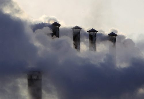 STANDUP - COLD WEATHER - Smoke billows from the stacks at Maple Leaf on the corner of Lagimodiere and Marion. This plants smokes meat and is smelled by hundreds of thousands of drivers every month. BORIS MINKEVICH / WINNIPEG FREE PRESS November 26, 2014
