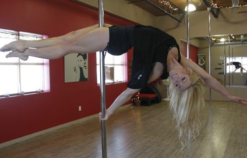 49.8 TRAINING BASKET.Tara Meyer, Canadian pole fitness champion in her studio.This is called the Lay Back.  Wayne Glowacki / Winnipeg Free Press Nov. 26  2014