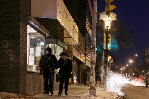 Pedestrians brave a -26C windchill on Broadway, as steam rises from the sewer grates Wednesday. 141126 - Wednesday, November 26, 2014 - (Melissa Tait / Winnipeg Free Press)
