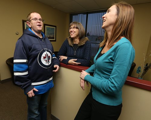 Jeannette Thiessen (second left) and her son Donovan chat with Epic Opportunities executive director Ruby Reimer at Epic Opportunities offices in St. James on Wed., Nov. 26, 2014. Epic Opportunities exists to provide holistic, person-centred supports to people with intellectual disabilities and to promote inclusive communities. RE: philanthropy page on Nov. 29, 2014 Photo by Jason Halstead/Winnipeg Free Press