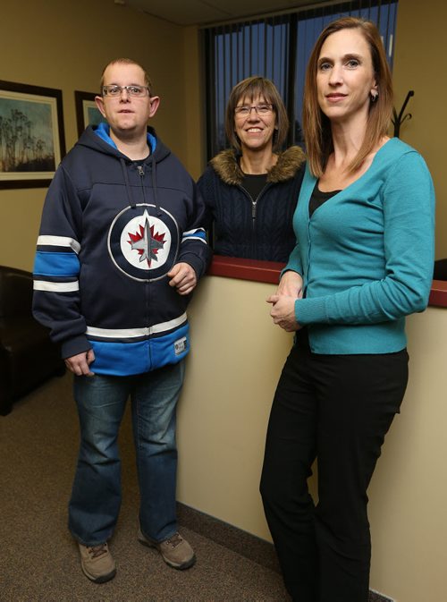 Jeannette Thiessen (second left) and her son Donovan chat with Epic Opportunities executive director Ruby Reimer at Epic Opportunities offices in St. James on Wed., Nov. 26, 2014. Epic Opportunities exists to provide holistic, person-centred supports to people with intellectual disabilities and to promote inclusive communities. RE: philanthropy page on Nov. 29, 2014 Photo by Jason Halstead/Winnipeg Free Press