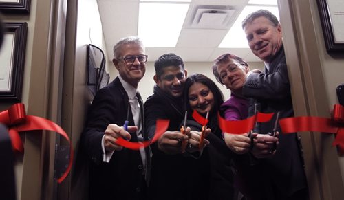 The new podiatry room officially opened  in the Saul Sair Health Centre part of the Siloam Mission with ribbon cutting by from left, Brian Scharfstein, pres. Canadian Footwear, Anis Khan and wife  Dr. Tejel Patel, Angelika Fletcher, Manager Saul Sair Health Centre and Floyd Perras, executive director of Siloam Mission.  Podiatry and foot care services are essential to those experiencing homelessness, many cope with diabetes, circulation issues, or other conditions which stress foot health. The new podiatry room provides a professional, modern, and well-equipped clinical setting for these critical services. Several devoted podiatrists and foot nurses volunteer their time and expertise to Siloam Mission clients every week. The Canadian Footwear and the Foot Health Centre have  been  providing quality footwear and custom orthotics for patient referrals. The facility has been established thanks to the efforts of Dr. Tejel Patel and her husband, Mr. Anis Khan, generous donations from Fortress Real Developments, MADY Development Corp., the Mennonite Brethren Collegiate Institutes Youth in Philanthropy Committee, with help from dedicated volunteer, Chantel  Blunderfield. Wayne Glowacki / Winnipeg Free Press Nov. 27  2014