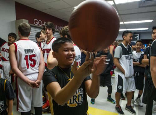 Raphael Palmaera, 10, along with almost 1,000 other basketball players gathered Sunday to take part in the opening ceremonies for the Philippine Basketball Association Winnipeg Basketball League.  141123 - Tuesday, November 25, 2014 -  (MIKE DEAL / WINNIPEG FREE PRESS)