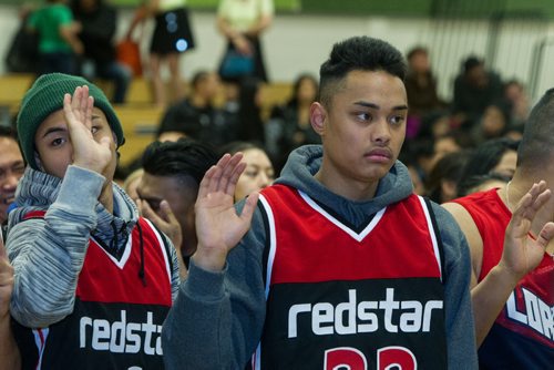 Joseph Medrano and Josh delos Reyes (right) hold their hands up while they take the oath of sportsmanship during the opening ceremonies at the Garden City Collegiate gym. Almost 1,000 players gathered Sunday to take part in the opening ceremonies for the Philippine Basketball Association Winnipeg Basketball League.  141123 - Tuesday, November 25, 2014 -  (MIKE DEAL / WINNIPEG FREE PRESS)
