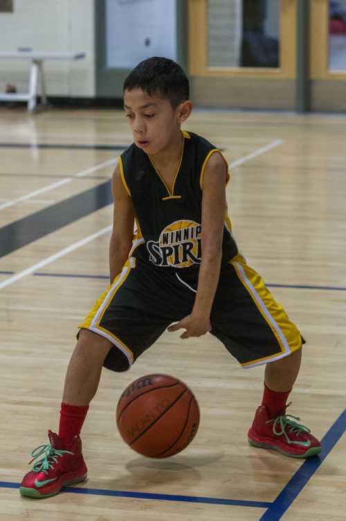 Kyle Dayanghirang of Winnipeg Spirit warms up before a game. Almost 1,000 players gathered Sunday to take part in the opening ceremonies for the Philippine Basketball Association Winnipeg Basketball League.  141123 - Tuesday, November 25, 2014 -  (MIKE DEAL / WINNIPEG FREE PRESS)