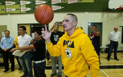 MLA Kevin Chief, Minister of Jobs and the Economy gets ready to toss the opening jump shot as almost 1,000 players gathered Sunday to take part in the opening ceremonies for the Philippine Basketball Association Winnipeg Basketball League.  141123 - Tuesday, November 25, 2014 -  (MIKE DEAL / WINNIPEG FREE PRESS)
