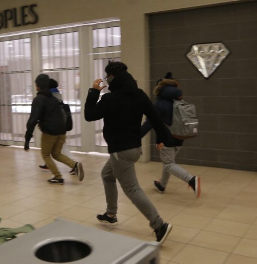 LOCAL .Black Friday , about 2 dozen people raced into Polo Parks west door in search of deals at 6am NOV. 28 2014 / KEN GIGLIOTTI / WINNIPEG FREE PRESS