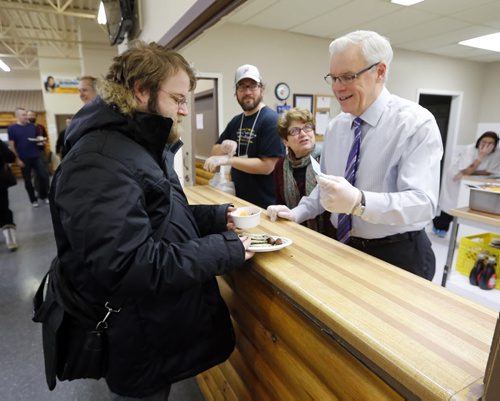 Stdup .Judy" Wasylycia-Leis visits  Greg Selinger  as he servered   Wild Blueberry Pancakes-Supports 50 employment opportunities, 24 local artisans and 5 performers in our inner city .WINNIPEG, MB Äì November 26, 2014ÄìLocal Investment Toward Employment (LITE) is hosting their Annual Wild Blueberry Pancake Breakfast for the 18th time. On the morning of Friday, November 28th hundreds of people will attend the event at the Indian and M¾©tis Friendship Centre in support of LITE initiatives Äì funding employment opportunities that empower, train and build skills for people breaking out of poverty in our inner city.This is a truly community focused event with LITE hiring the catering services of Spence Neighbourhood Association, Native WomenÄôs Transition Centre (NWTC), Wolseley Family Place (WFP), Andrews Street Family Centre and Neechi Foods. The catering program participants prep and serve food at the Breakfast. These catering programs give people facing barriers to employment the skills needed to enter the workforce. NOV. 28 2014 / KEN GIGLIOTTI / WINNIPEG FREE PRESS