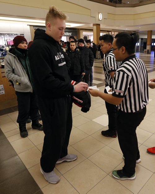 Tiernan Marshall, 14 years old was first in line for shoes . LOCAL .Black Friday , there was a long line of people outside Foot Locker at Polo Parks as staff distributed chits for Air Jordan runners before the store was open to the public at 7am .  NOV. 28 2014 / KEN GIGLIOTTI / WINNIPEG FREE PRESS