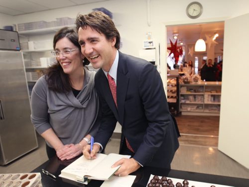 Liberal leader  Justin Trudeau signs a book for Constance Menzies at her business Chocolatier Constance Popp- 180 Provencher Blvd in  Winnipeg  Friday afternoon- Standup Photo Nov 28, 2014   (JOE BRYKSA / WINNIPEG FREE PRESS)