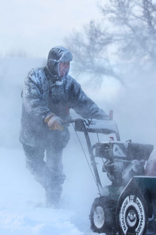 Bernard Fillion gets his snow blower out for the first time this season to clear his driveway and front sidewalk of snow Saturday morning in south St. Vital. Standup photo. Nov 29,  2014 Ruth Bonneville / Winnipeg Free Press